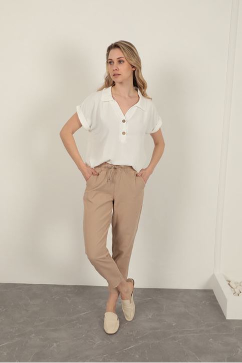 بنطلون نسائي بأرجل مزينة بالشراشيب - بيج